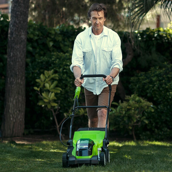 Greenworks 40v 35cm cordless lawnmower in use front view