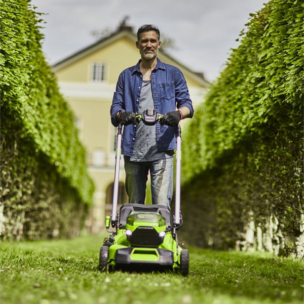 Greenworks 60V cordless lawnmower in use front view